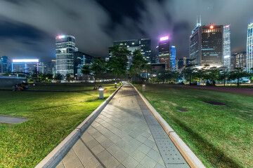 Public park and skyline in downtown district of Hong Kong city at night