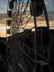 Bratislava ferris wheel detail at sunset with castle in background drone photo