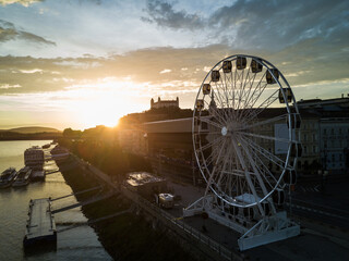 Bratislava ferris wheel, castle and Danube river drone photo at sunset nobody