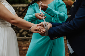 Traditional handfasting ceremony during the wedding