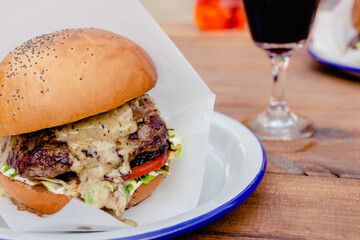 beef burger with mushrooms, tomato, cheese
