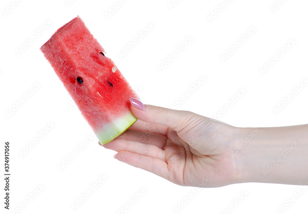 Wall mural Piece of watermelon in hand on white background isolation