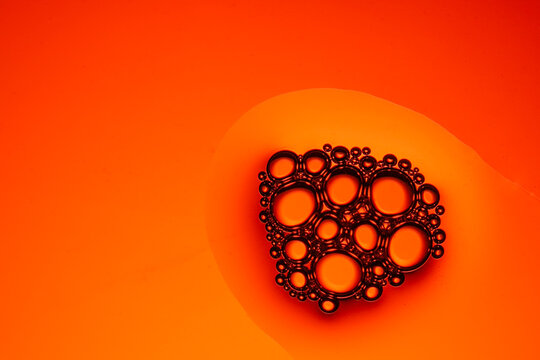 Close-up Of Bubble Against Orange Background