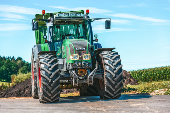 BAVARIA / GERMANY - AUGUST 20, 2020: Fendt tractor with a loader wagon, working on a biogas plant