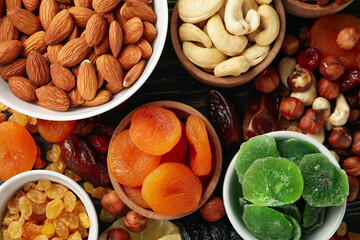 Bowls with dried fruits and nuts, top view