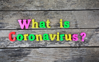 Fototapeta premium Question What is coronavirus on a wooden table