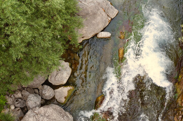 Fast mountain water stream seen from above. Nature scene for backgrounds