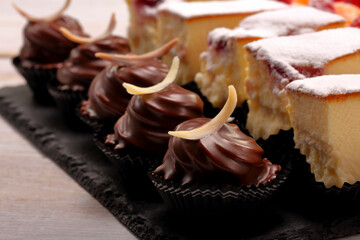 Catering sweets, closeup of various kinds of cakes on event or wedding reception.
