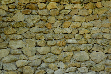 Masonry cobblestone wall texture. A fortress, a protective wall, a solid foundation.