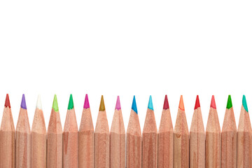 Wooden natural beige colored pencils isolated on white background flat lay. Copy space for text. Pastel drawing pen assortment. Stationary for art lessons, artist classes in kindergarten, school, coll