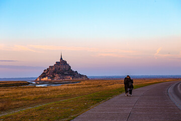 Mont-Saint-Michel and its Bay at sunset, in Normandy, France.