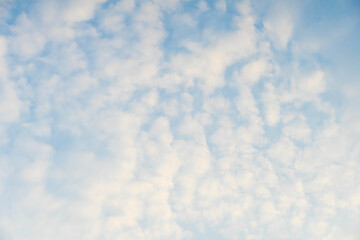 blue sky with white fluffy clouds	
