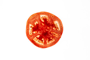 Macro detail of a slice of a fresh tomato on white background.Transparency.
