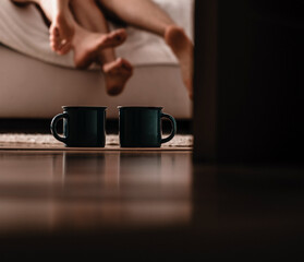 Couple sleeping in bed. Coffee cups. Sensual. Hotel room. Bedroom. 