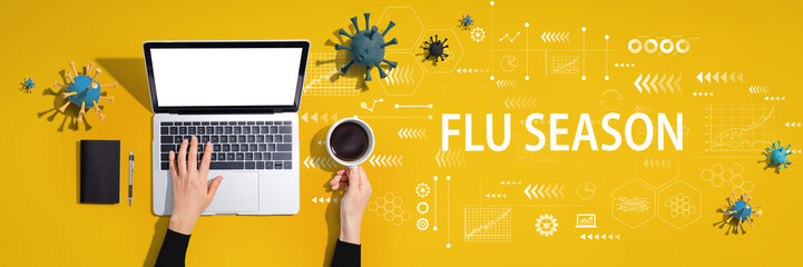 Fototapeta na wymiar Flu Season Coronavirus theme with person using a laptop computer