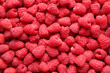 Fresh sweet ripe raspberries as background, closeup