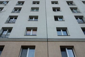 texture of a row of windows on a gray wall of a house