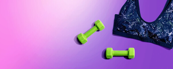 Fitness theme with dumbbells and a sportswear