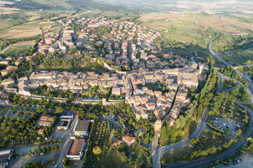 Fototapeta na wymiar Flying over San Quirico d'Orcia. A country in Tuscany