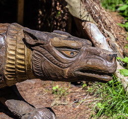Fototapeta na wymiar carved wood figure idol tales wolf