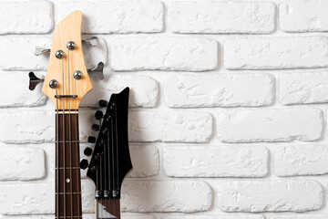 Guitar headstock with tuners on dark background