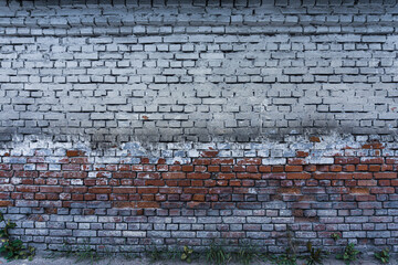 Old, destroyed brick wall in the city