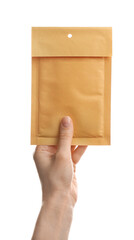 Woman holding kraft paper envelope on white background, closeup