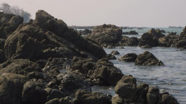 rocky tropical beach in 
nagapali myanmar