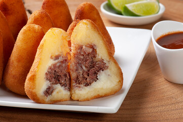 Dried beef coxinha. Appetizer of Brazilian cuisine served in bars and parties.