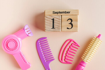 A wooden calendar for September 13 and a toy set for the Barber. The day of the hairdresser.