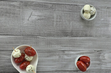 Snack with cherry tomatoes and mozzarella cheese