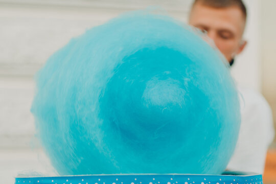 Cotton Candy floss machine making blue candyfloss outdoor