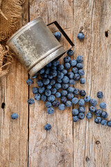 Spilled blueberries on rustic table