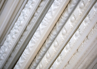 Classic patterned polyurethane skirting board stacked © VPales