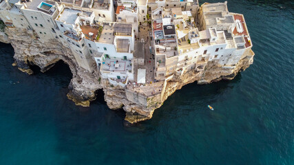 Aerial view of Polignano a Mare, a village built on the edge of the sandstone cliffs above the...