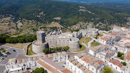 Aerial view of the castle of Monte Sant'Angelo on the Gargano peninsula in Italy, photographed from a drone in flight - Medieval stronghold on a hilltop over the Adriatic Sea