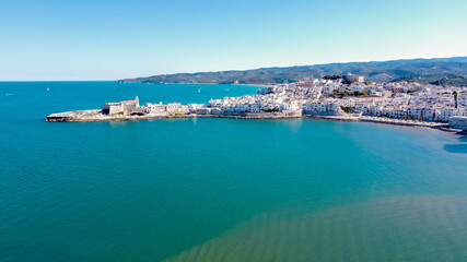 Fototapeta premium Aerial view of Vieste on the Gargano Peninsula in Italy - Medieval city with white buildings built on a narrow peninsula over the Adriatic Sea