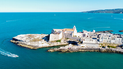 Aerial view of Vieste on the Gargano Peninsula in Italy - Medieval city with white buildings built on a narrow peninsula over the Adriatic Sea