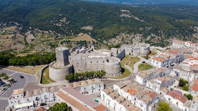 Aerial view of the castle of Monte Sant'Angelo on the Gargano peninsula in Italy, photographed from a drone in flight - Medieval stronghold on a hilltop over the Adriatic Sea
