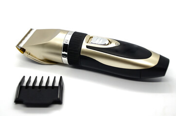 Electric pet clipper with plastic nozzle on a white background. Grooming tools for the hygienic...