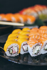 Sushi with salmon, cream cheese Philadelphia, cucumber and wasabi