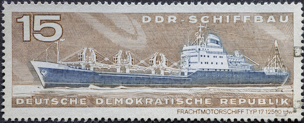 GERMANY, DDR - CIRCA 1971: a postage stamp from Germany, GDR showing a freight motor ship. Text: GDR shipbuilding.