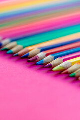 Back to school concept. Colourful pencils on pink Background. Copyspace. Top view.  Flat lay.