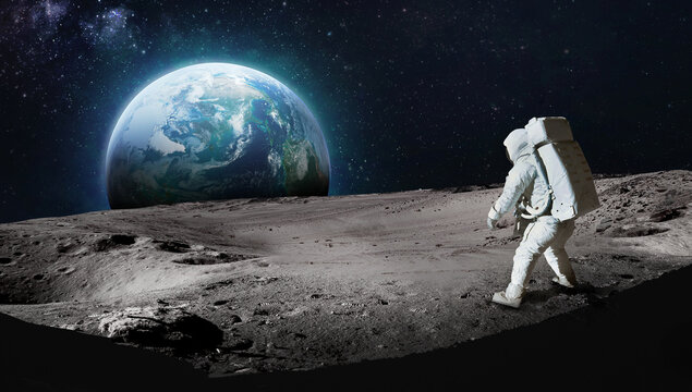 Astronaut on surface of the Moon. Earth on background. Apollo space program. Exploration of Moon. Dark crater. Elements of this image furnished by NASA
