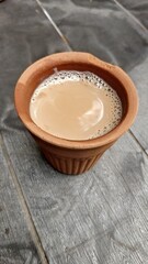 A kulhar or kulhad cup (traditional handle-less clay cup) from North India filled with hot Indian tea
