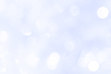 Obraz premium Bokeh light on blue background, sky with circle glitter light blue. Snow abstract soft glowing with vivid bright light and bokeh blur effect. 