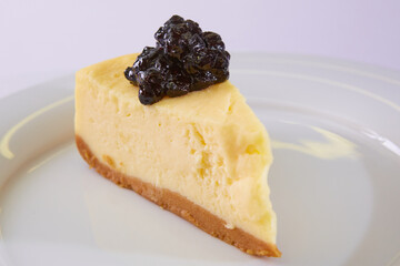 The Blueberry Cheesecake Pie on white plate. Shallow dof.