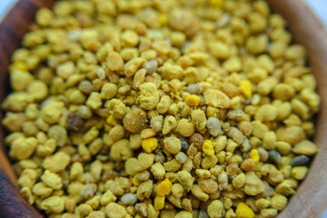 Bee pollen. A valuable and useful beekeeping product and a natural antiseptic. Closeup. Blurred.