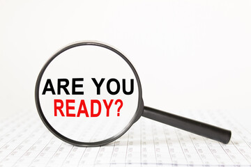 words in a magnifying glass on a white background. business concept