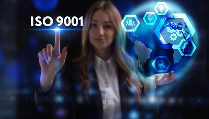 Business, Technology, Internet and network concept. Young businessman working on a virtual screen of the future and sees the inscription: ISO 9001